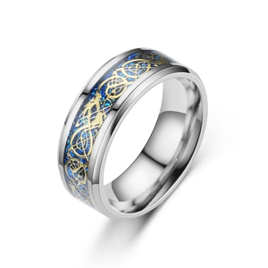 Detail showing the blue carbon fiber inlay and golden Celtic dragon pattern on the ring band