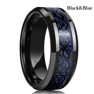 Detailed close-up of a black stainless steel ring with blue Celtic dragon inlay motif