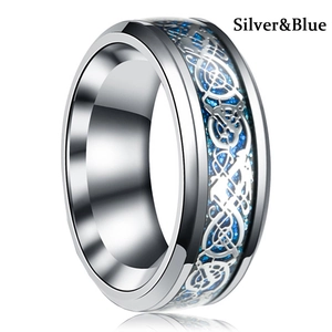 Close-up of silver stainless steel ring with blue glitter inlay and Celtic dragon pattern