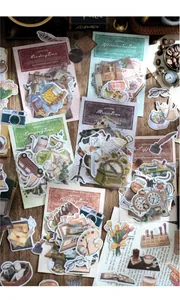 Detalle de pegatinas vintage con tema de café, cámara retro e ilustraciones florales