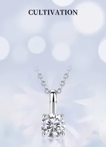 Macro detail of round brilliant cut lab-grown diamond necklace with four-prong setting