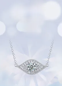 Macro shot of silver evil eye necklace with lab-grown diamond and sparkling details