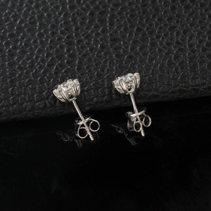 Close-up of S925 sterling silver six-prong heart stud earrings with round-cut stones