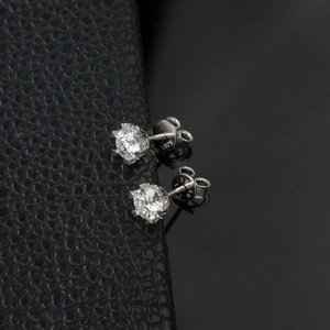 Close-up of S925 sterling silver stamp on heart six-prong moissanite stud earring