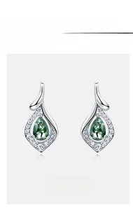 Detail of silver drop earrings with green moss agate and small cubic zirconia stones