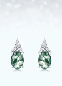 Macro shot of oval moss agate earrings in S925 silver with leaf detail and tiny zircon