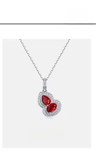 Detail of S925 silver gourd necklace with ruby gemstone and pave diamond accents