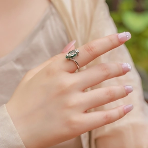 Natural green moss agate S925 silver ring with marquise stone worn on model finger