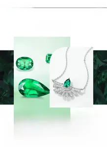 Detail of pear-cut emerald necklace with fanned diamond base on a fine silver chain