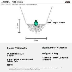 Macro detail of S925 silver necklace featuring a fan-shaped emerald pendant with dimensions