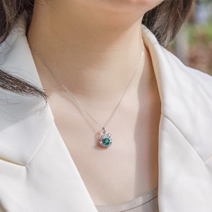 Elegant S925 sterling silver necklace with round emerald pendant on a female model