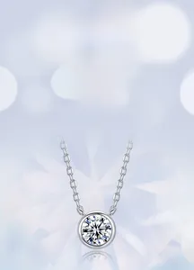 Detail of a minimalist lab-grown diamond pendant on an S925 sterling silver bubble chain