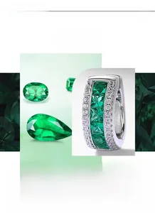 Detailed macro view of silver earrings featuring five square emeralds and white zircons