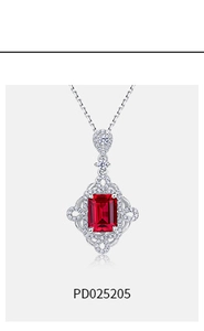 Detail view of S925 silver pendant featuring a rectangular red ruby and pavé set diamonds