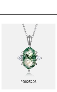 Macro view of a hexagonal moss agate pendant in S925 silver with a fine link chain