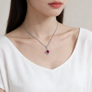 S925 sterling silver necklace featuring a princess cut ruby pendant on a female model