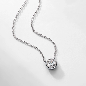 Minimalist S925 sterling silver necklace with a bezel-set round diamond on silver chain