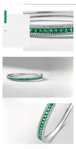 Detailed macro view of S925 sterling silver bangle with rectangle emerald gemstone