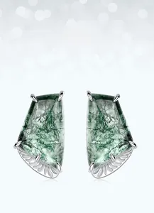 Detail showing trapezoidal moss agate earrings with silver feather textured settings