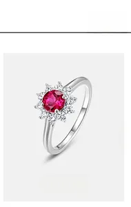 Macro shot of S925 sterling silver ring showing sun flower ruby setting and S925 stamp
