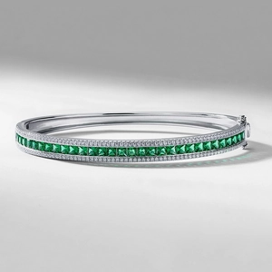 Elegant S925 silver bangle with square-cut emeralds and pavé diamonds on a white background
