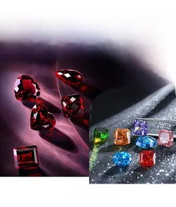 Close-up of laboratory-grown rubies and emeralds in various gemstone cuts for fine earrings