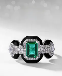 Macro view of S925 emerald ring with white zircon pave and black enamel accents