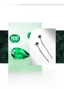 Macro detail of S925 silver emerald tassel earrings and oval loose gemstones
