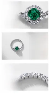 Detail view of S925 silver ring featuring round lab emerald and pavé cubic zirconia