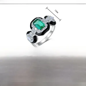 Detail view of S925 silver ring with 12mm emerald lab-grown stone and black enamel