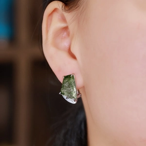 Minimalist S925 silver clip earrings with trapezoid green moss agate on a model's ear