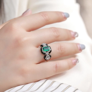 Art Deco S925 sterling silver ring with emerald-cut green gemstone and black enamel