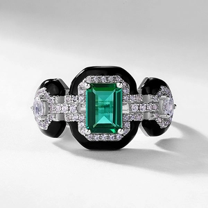 Art Deco S925 silver ring featuring emerald cut green gemstone with black enamel accents