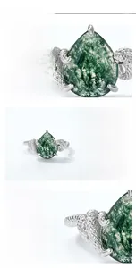 Macro detail of teardrop green moss agate and snake motif on S925 silver ring