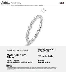 Macro detail of S925 sterling silver band with marquise cut moissanite stones and 2mm width