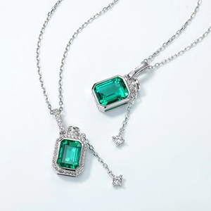 S925 sterling silver necklace with emerald-cut green gemstone and elegant tassel pendant