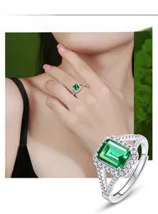 Detail of a 1.25ct emerald cut green gemstone ring with a cross hollowed band design