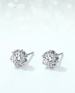 Macro shot of six-prong moissanite stud earrings featuring classic snowflake design in S925 silver