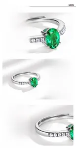 Detailed view of S925 sterling silver ring with oval emerald gemstone and micro-pave diamonds