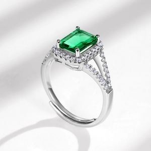 Classic S925 silver ring with 1.25ct emerald cut green gemstone and halo diamonds
