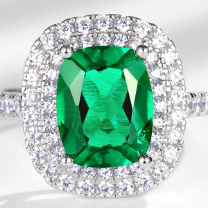 Luxurious S925 silver ring featuring a large cushion-cut emerald with double diamond halos