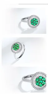 Macro detail of S925 silver ring featuring emerald gemstone and cluster set diamonds