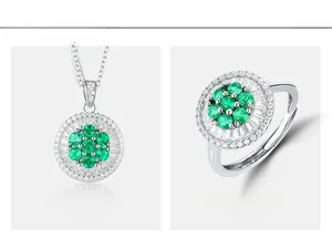 Detail of lab-grown emerald ring and pendant set with round cut stones and micro-pave diamonds
