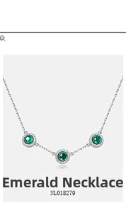 Detail view of a round lab-grown emerald necklace with halo cubic zirconia setting