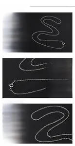 Detailed macro view of S925 sterling silver chain with a three-ring adjustable clasp tail