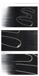Detail of S925 sterling silver chain featuring a lobster clasp and adjustable loops