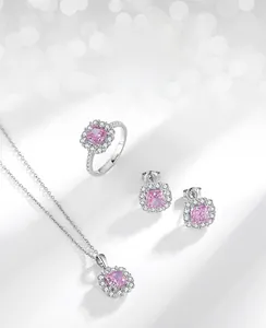 Detailed view of square pink carbon diamond jewelry set with halo zircon accents