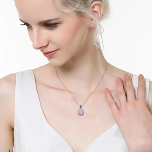 Elegant rose gold necklace with square pink gemstone pendant on a female model