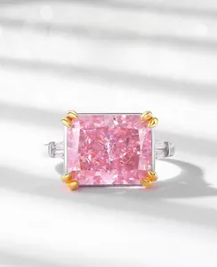 Macro detail of ice-cut pink carbon diamond ring with silver band and side accents