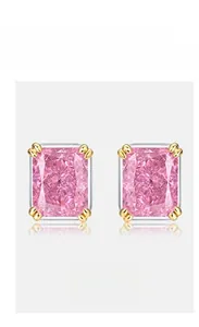 Close-up of pink radiant cut high-carbon diamond earrings in gold four-claw setting
